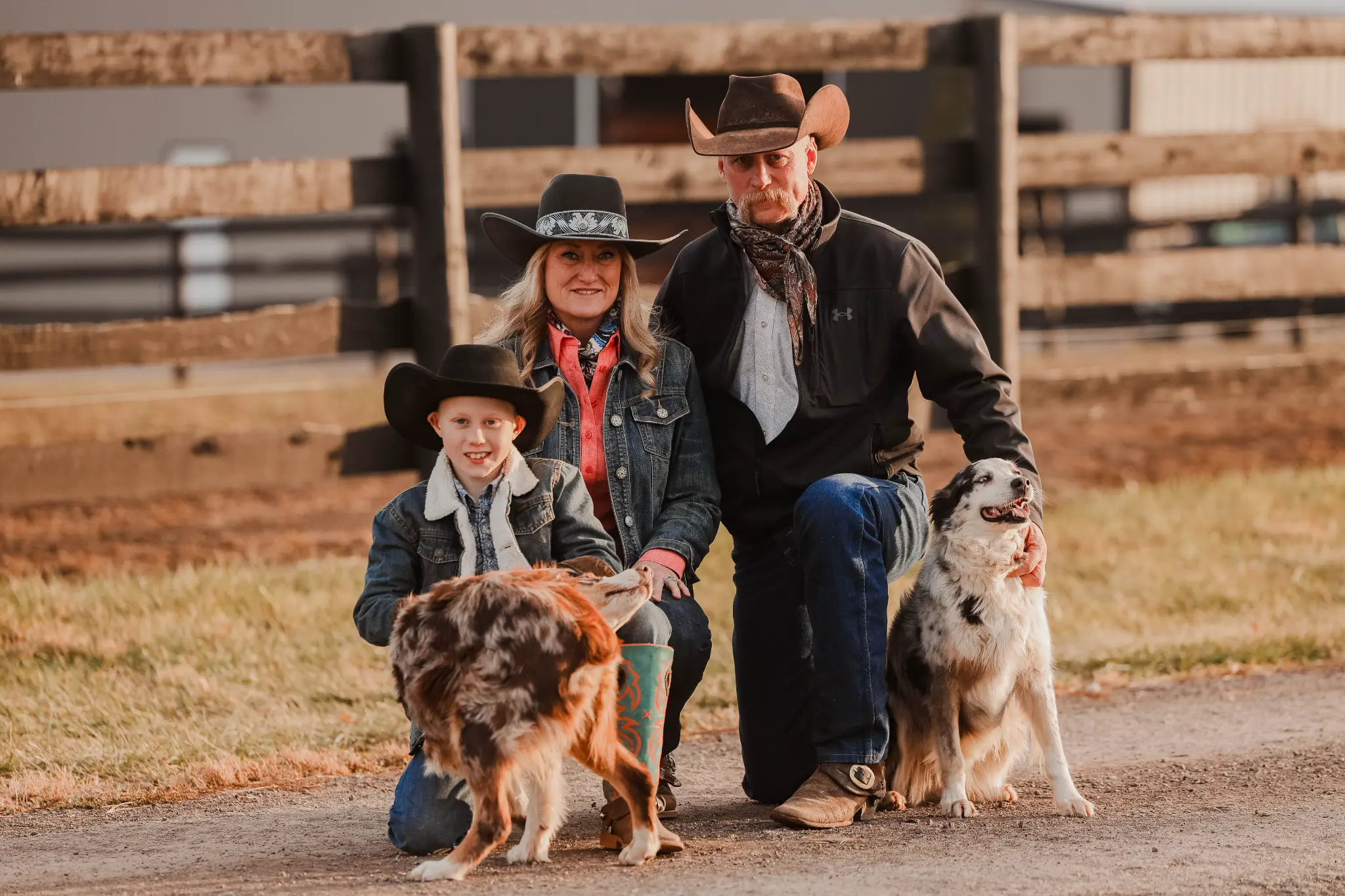 The Thompson family with their ranch dogs at Lazy 4T Ranch